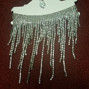 A silver choker with diamonds